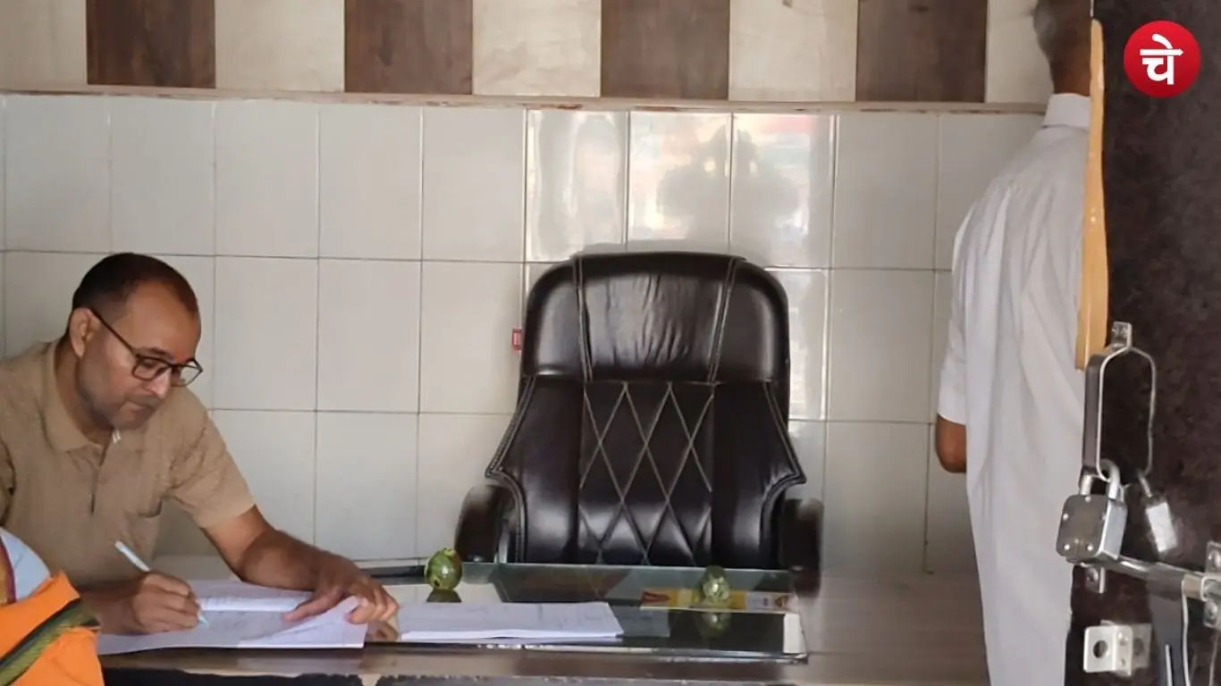 A photograph of an official seated in the Amethi block office.