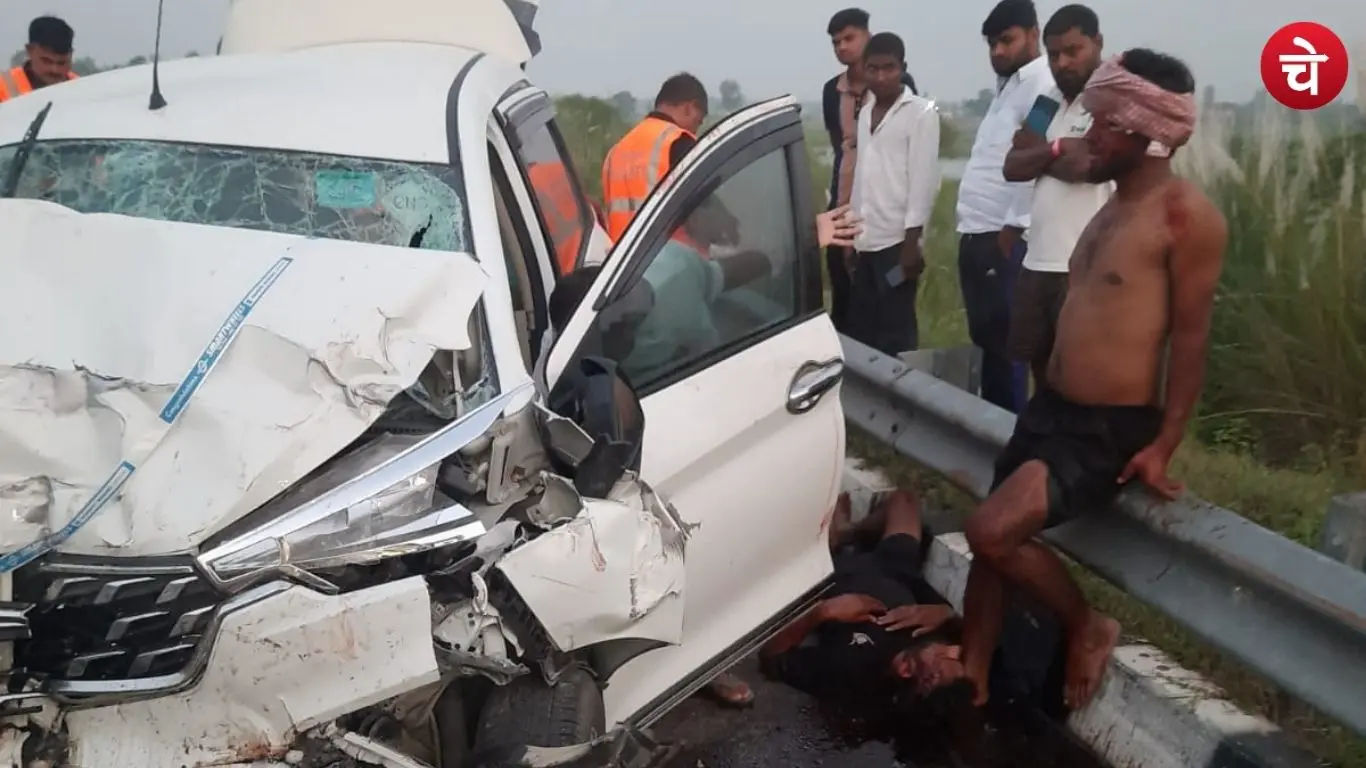 An Ertiga car damaged in an accident on the Purvanchal Expressway, with relief and rescue personnel gathered at the scene