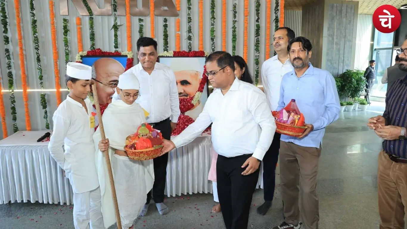 CEO Krishna Karunesh and other officials paying tribute during the Gandhi Jayanti program at the Noida Authority office in Sector 96